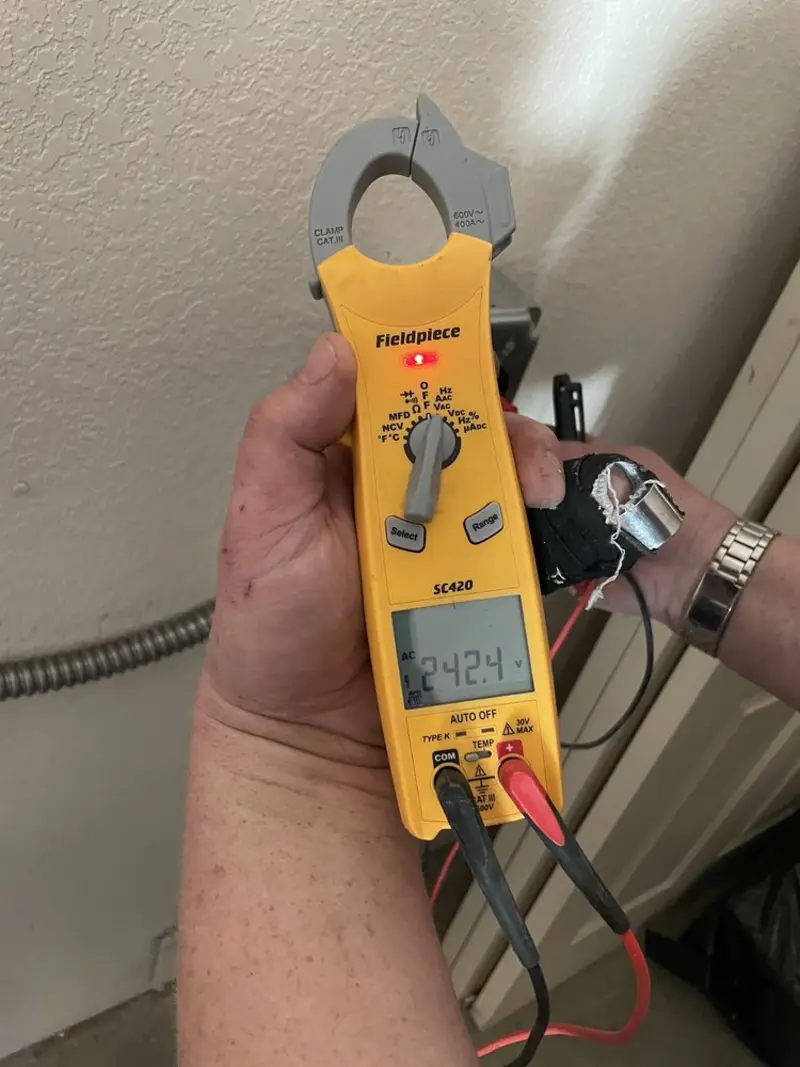Voltage testing with clamp meter during Recessed Lighting Installation in St. Peters